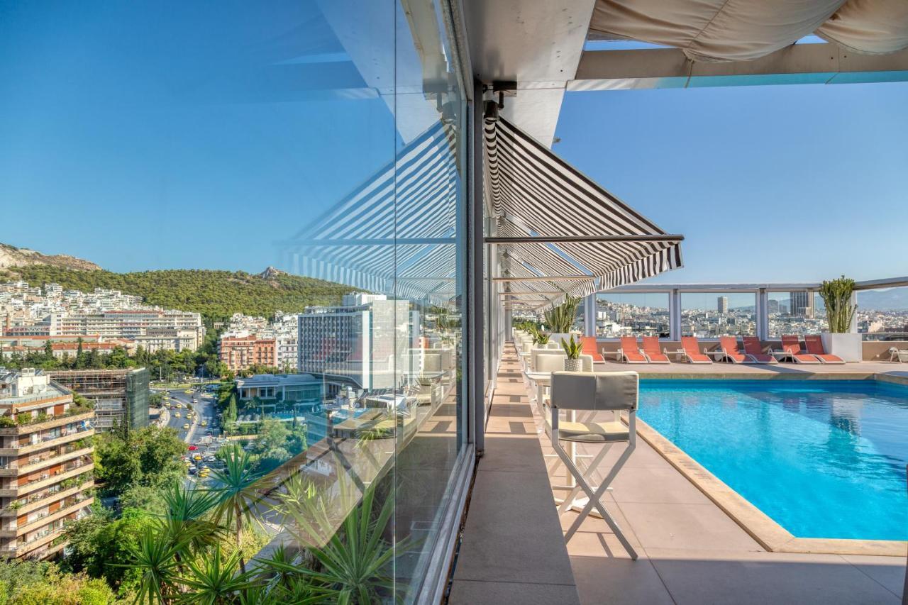 Divani Caravel Atenas Exterior foto The pool at the hotel